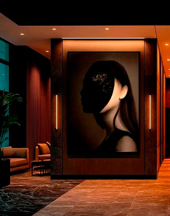Dark ambient hotel lobby with a black-and-white silhouette artwork.